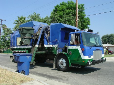 Man and van departing with household rubbish for safe disposal